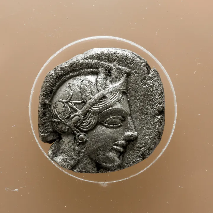 Athenian silver tetradrachm, around 500 to 400 BC, showing Athena on the obverse and an owl with olive twig on the reverse