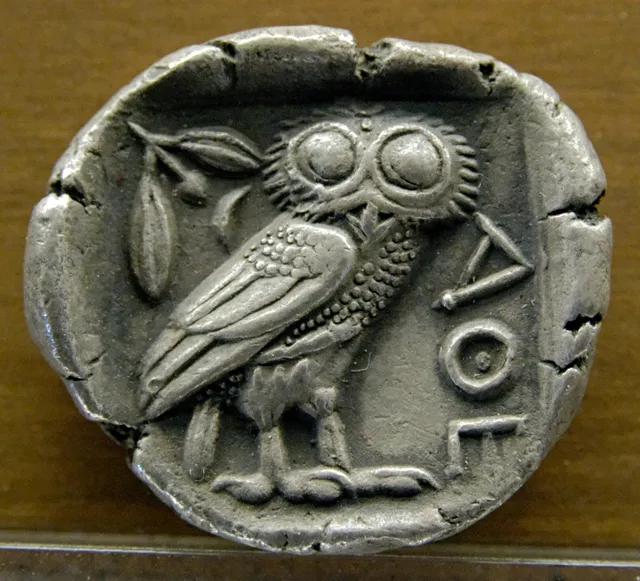 Reverse of an Athenian tetradrachm from about 480 to 420 BC, showing the owl, olive sprig and crescent moon